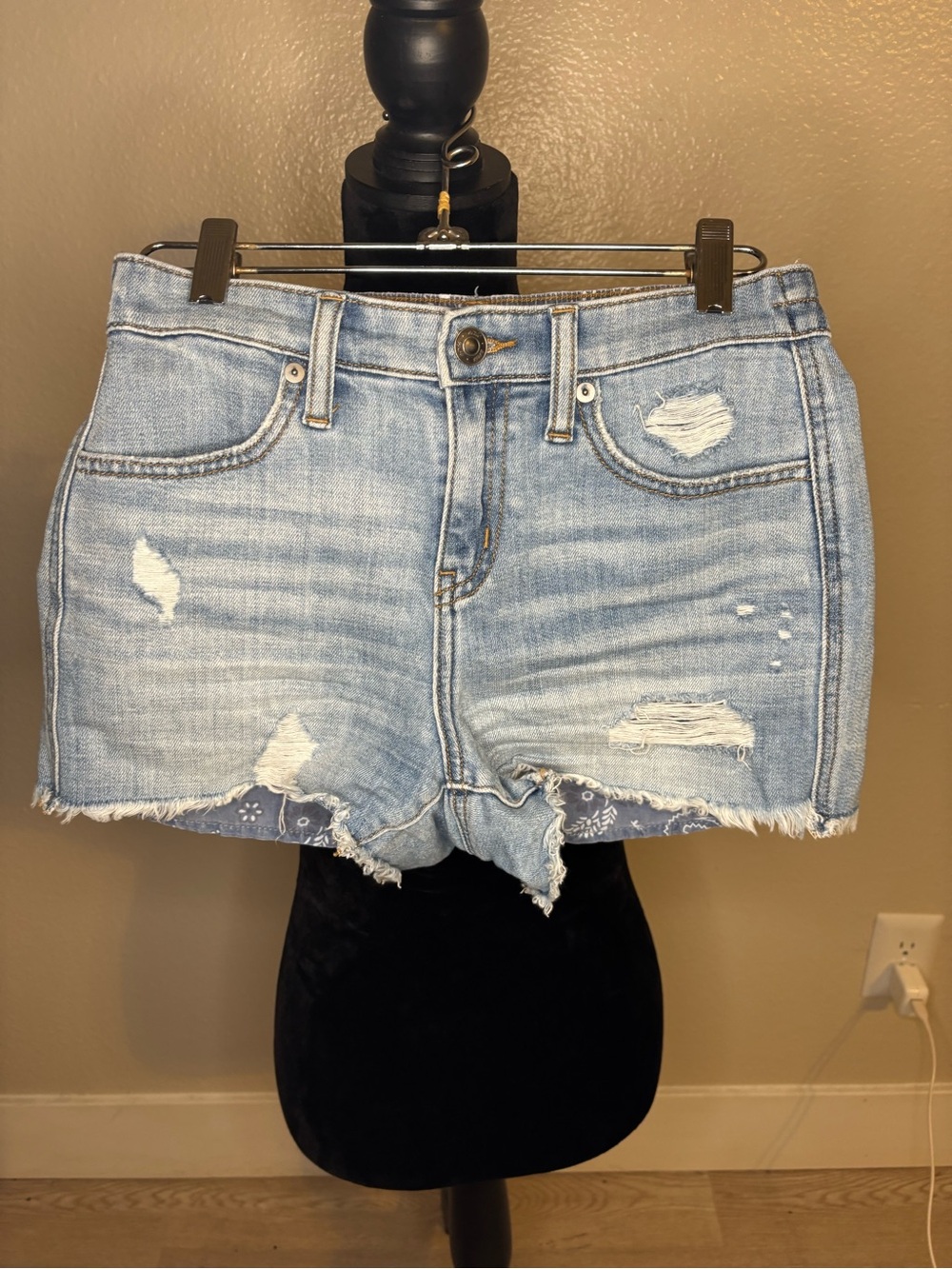 aerie light blue denim top with white print and tan stitching